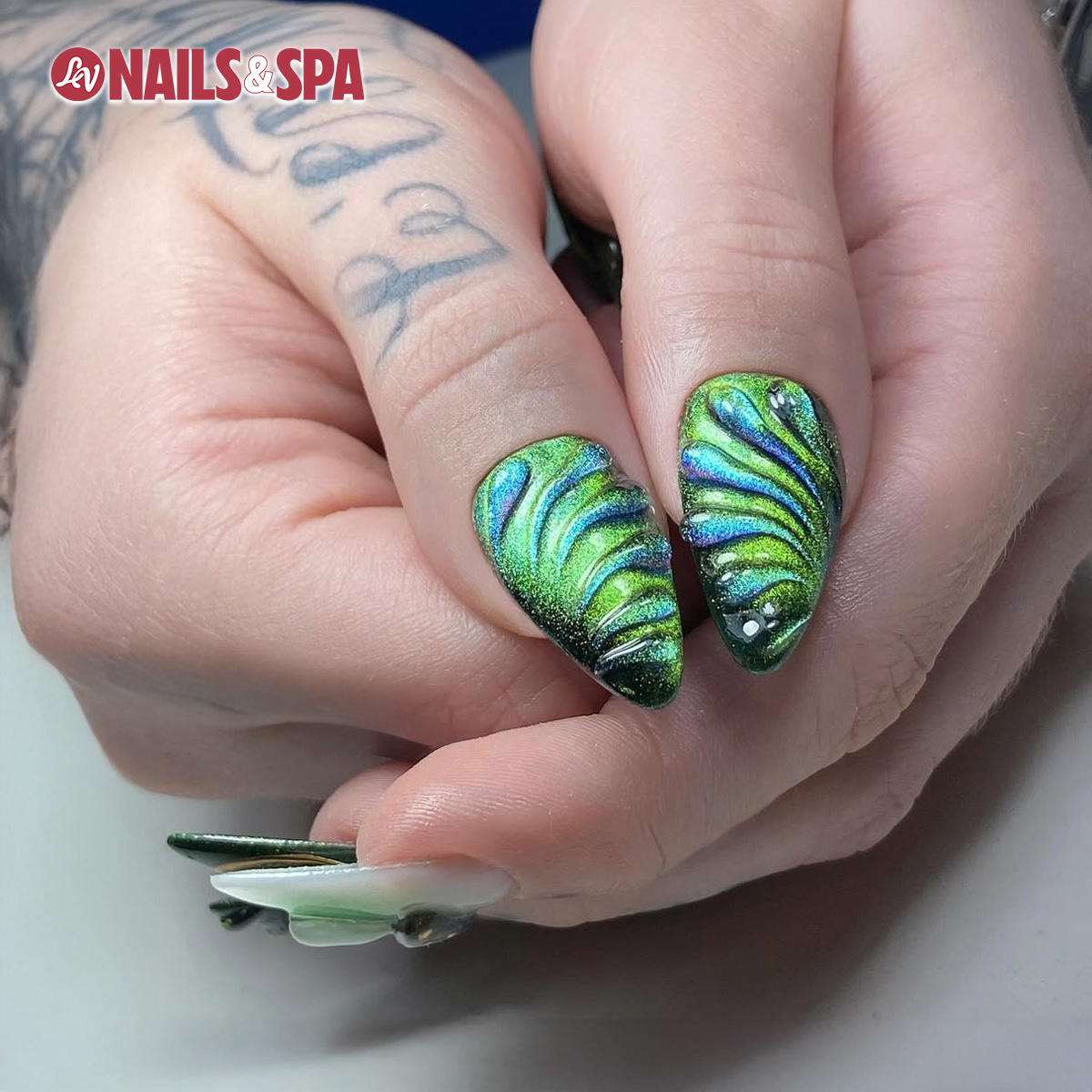 Green chrome nail design from LV Nails & Spa